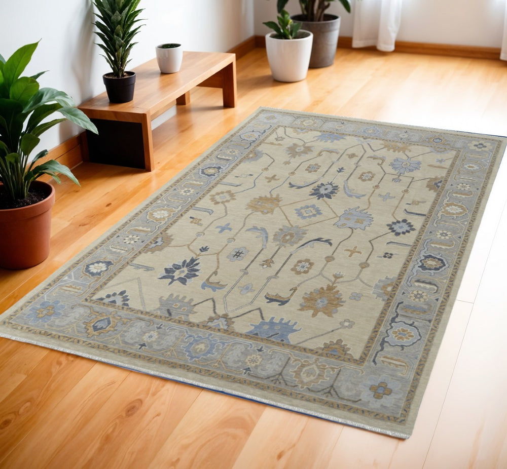 HomeRoots 4' Hand-Knotted Wool Area Rug with Floral Design in Gray, Ivory, and Blue – Timeless Elegance! 4' X 6' 566292