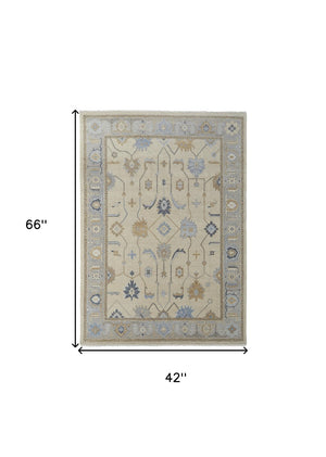 HomeRoots 4' Hand-Knotted Wool Area Rug with Floral Design in Gray, Ivory, and Blue – Timeless Elegance! 4' X 6' 566292