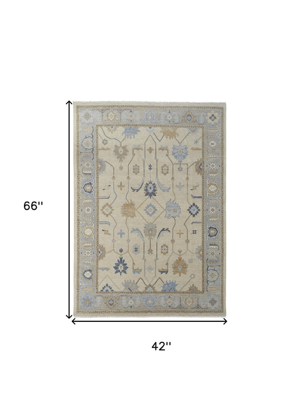 HomeRoots 4' Hand-Knotted Wool Area Rug with Floral Design in Gray, Ivory, and Blue – Timeless Elegance! 4' X 6' 566292