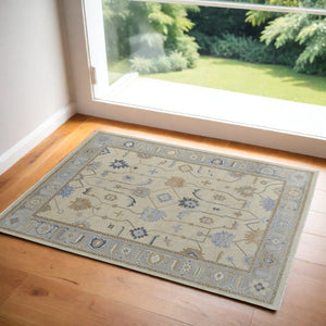 HomeRoots 4' Hand-Knotted Wool Area Rug with Floral Design in Gray, Ivory, and Blue – Timeless Elegance! 2' X 3' 566297