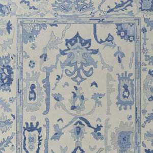 HomeRoots 4' Ivory and Blue Floral Hand-Knotted Wool Area Rug with Elegant Fringe for Timeless Home Style 4' X 6' 566298