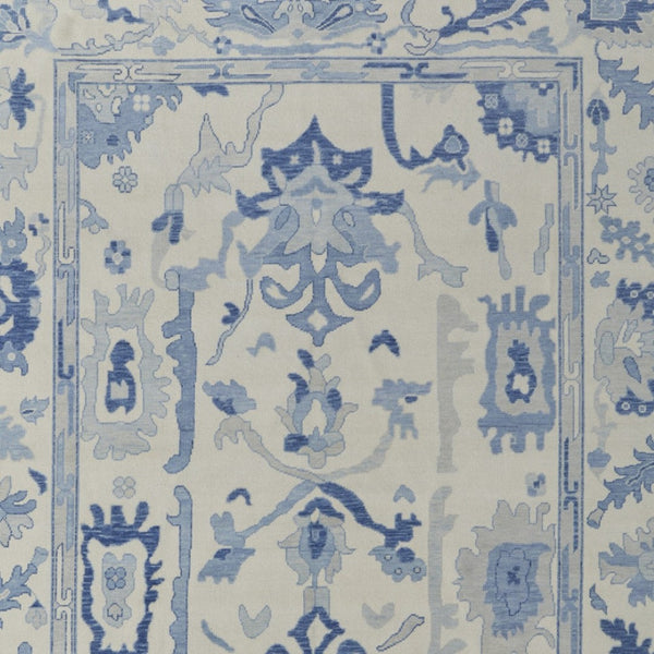 HomeRoots 4' Ivory and Blue Floral Hand-Knotted Wool Area Rug with Elegant Fringe for Timeless Home Style 6' X 9' 566299