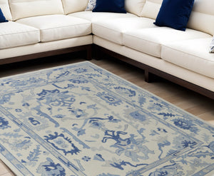 HomeRoots 4' Ivory and Blue Floral Hand-Knotted Wool Area Rug with Elegant Fringe for Timeless Home Style 8' X 10' 566300