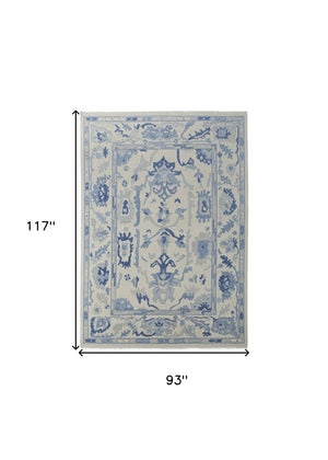 HomeRoots 4' Ivory and Blue Floral Hand-Knotted Wool Area Rug with Elegant Fringe for Timeless Home Style 8' X 10' 566300