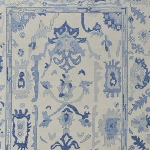 HomeRoots 4' Ivory and Blue Floral Hand-Knotted Wool Area Rug with Elegant Fringe for Timeless Home Style 9' X 13' 566302