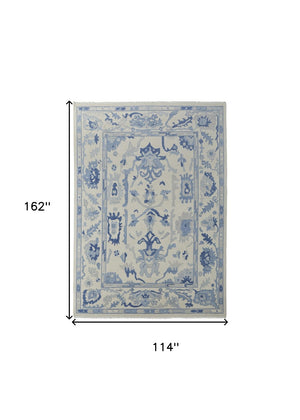 HomeRoots 4' Ivory and Blue Floral Hand-Knotted Wool Area Rug with Elegant Fringe for Timeless Home Style 9' X 13' 566302