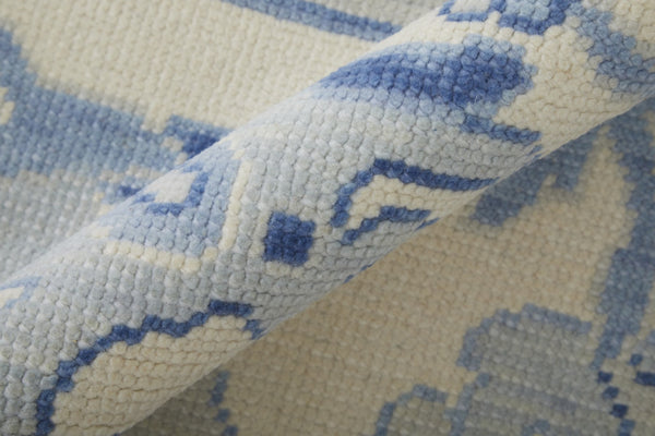 HomeRoots 4' Ivory and Blue Floral Hand-Knotted Wool Area Rug with Elegant Fringe for Timeless Home Style 2' X 3' 566303