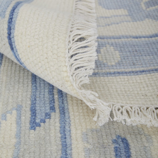 HomeRoots 4' Ivory and Blue Floral Hand-Knotted Wool Area Rug with Elegant Fringe for Timeless Home Style 2' X 3' 566303