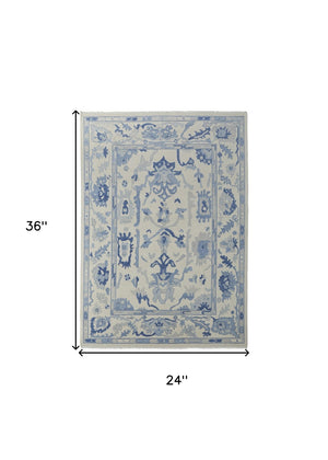 HomeRoots 4' Ivory and Blue Floral Hand-Knotted Wool Area Rug with Elegant Fringe for Timeless Home Style 2' X 3' 566303