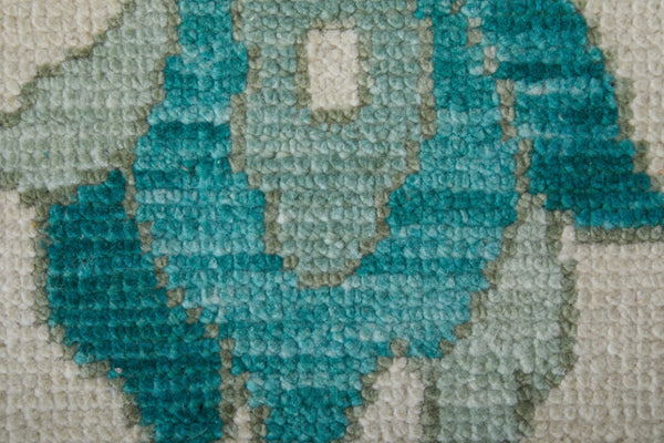 HomeRoots 4' Ivory and Blue Floral Hand-Knotted Wool Area Rug with Elegant Fringe for Timeless Home Style 4' X 6' 566304
