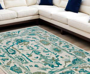 HomeRoots 4' Ivory and Blue Floral Hand-Knotted Wool Area Rug with Elegant Fringe for Timeless Home Style 8' X 10' 566306