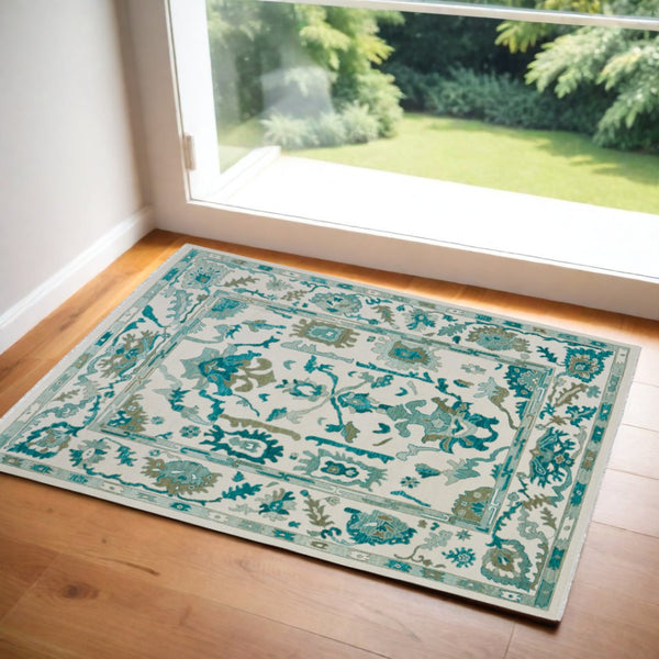 HomeRoots 4' Ivory and Blue Floral Hand-Knotted Wool Area Rug with Elegant Fringe for Timeless Home Style 9' X 13' 566308