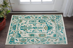 HomeRoots 4' Ivory and Blue Floral Hand-Knotted Wool Area Rug with Elegant Fringe for Timeless Home Style 2' X 3' 566309
