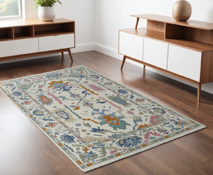 HomeRoots 4' Hand-Knotted Floral Wool Area Rug in Blue, Ivory & Pink - Durable, Stain-Resistant Design 4' X 6' 566310