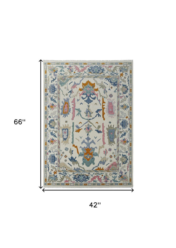HomeRoots 4' Hand-Knotted Floral Wool Area Rug in Blue, Ivory & Pink - Durable, Stain-Resistant Design 4' X 6' 566310