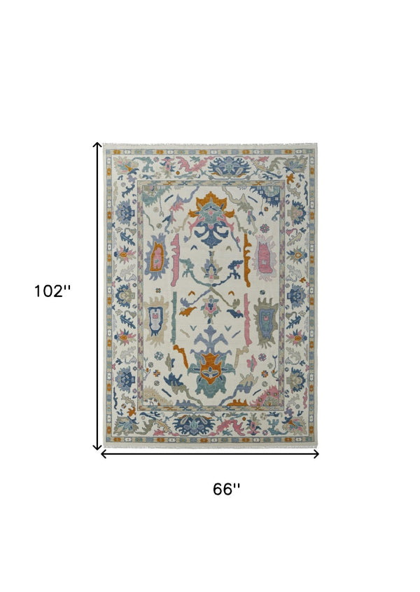 HomeRoots 4' Hand-Knotted Floral Wool Area Rug in Blue, Ivory & Pink - Durable, Stain-Resistant Design 6' X 9' 566311