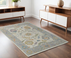 HomeRoots 4' Hand-Knotted Wool Area Rug with Gray, Ivory & Orange Floral Design - Elegant Fringed Finish 4' X 6' 566316