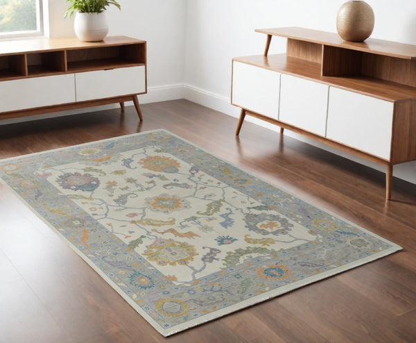 HomeRoots 4' Hand-Knotted Wool Area Rug with Gray, Ivory & Orange Floral Design - Elegant Fringed Finish 4' X 6' 566316
