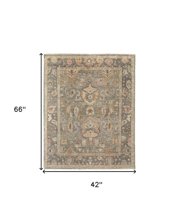 HomeRoots 4' Gray and Gold Hand-Knotted Wool Oriental Area Rug with Elegant Fringe for Timeless Home Style 4' X 6' 566401