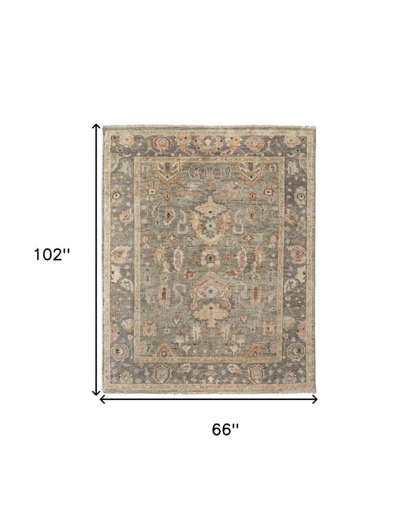 HomeRoots 4' Gray and Gold Hand-Knotted Wool Oriental Area Rug with Elegant Fringe for Timeless Home Style 6' X 9' 566402