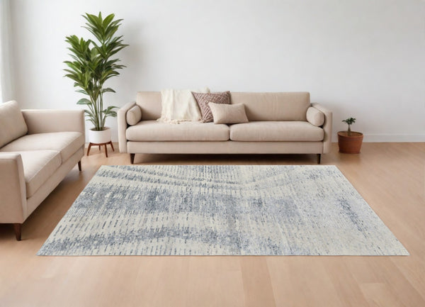 HomeRoots 3' Ivory Gray and Blue Abstract Hand-Knotted Area Rug - Elegant Soft Wool-Blend for Modern Spaces 6' X 9' 566638