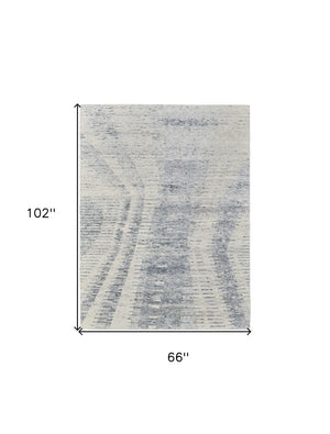HomeRoots 3' Ivory Gray and Blue Abstract Hand-Knotted Area Rug - Elegant Soft Wool-Blend for Modern Spaces 6' X 9' 566638