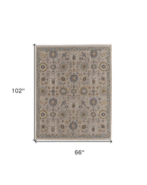 HomeRoots 4' Hand-Knotted Wool Oriental Area Rug in Tan, Brown, and Gray with Elegant Fringe Detail 6' X 9' 566795