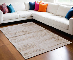 HomeRoots 5' Ivory and Tan Abstract Area Rug - Modern Power Loom Design for Stylish Living Spaces 5' X 8' 566840