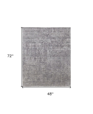 HomeRoots 3' Gray and Silver Abstract Hand-Woven Area Rug - Artisanal Craftsmanship for Modern Spaces 4' X 6' 566906