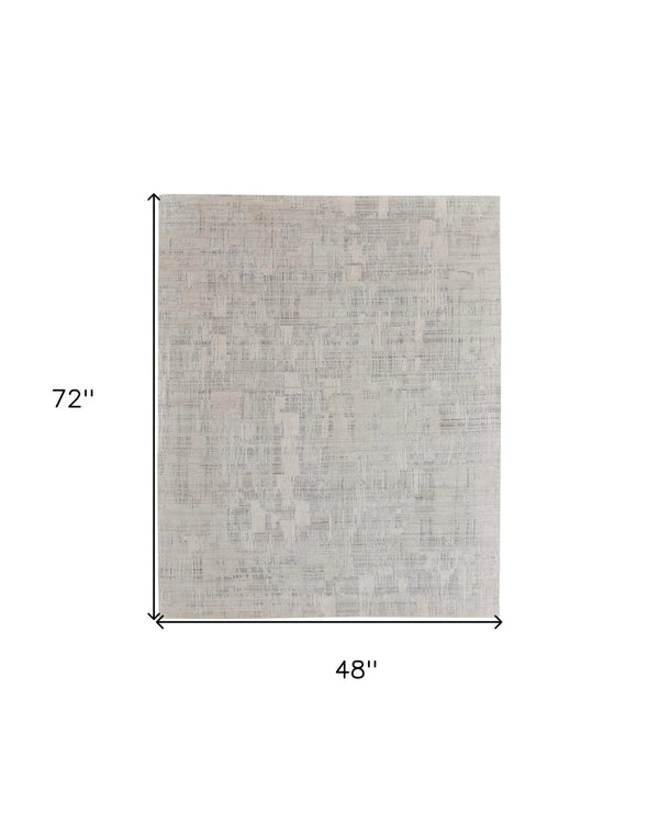HomeRoots 3' Hand-Woven Ivory and Gray Abstract Area Rug - Unique, Cozy, and Perfect for Modern Interiors 4' X 6' 566922