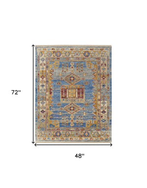 Homeroots 4' X 6' Blue Red And Yellow Wool Geometric Hand Knotted Area Rug With Fringe Blue Wool 567084
