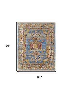 HomeRoots 3' Hand-Knotted Wool Area Rug with Geometric Blue, Red, and Yellow Design for Stylish Interiors 5' X 8' 567085