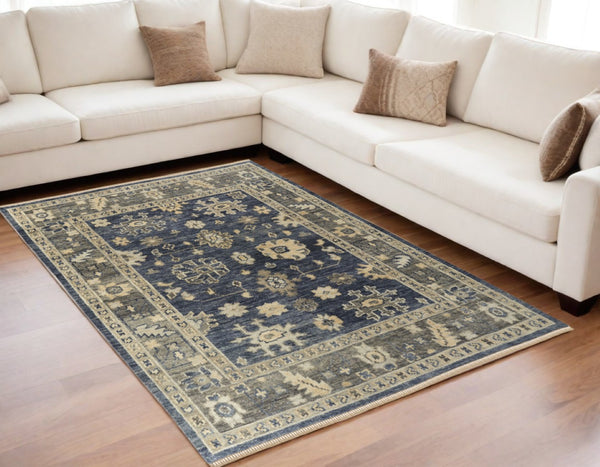 HomeRoots 3' Hand-Knotted Blue and Gray Floral Wool Area Rug with Fringe - Timeless Charm for Any Room 5' X 8' 567097
