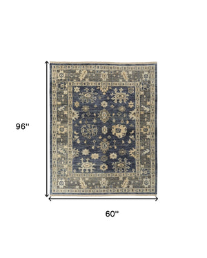 HomeRoots 3' Hand-Knotted Blue and Gray Floral Wool Area Rug with Fringe - Timeless Charm for Any Room 5' X 8' 567097
