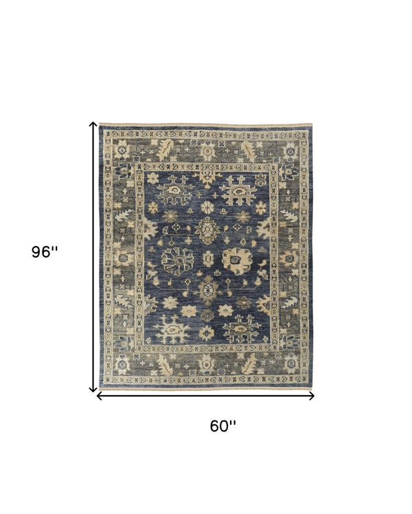 HomeRoots 3' Hand-Knotted Blue and Gray Floral Wool Area Rug with Fringe - Timeless Charm for Any Room 5' X 8' 567097