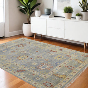HomeRoots 3' Hand-Knotted Blue and Gray Floral Wool Area Rug with Fringe - Timeless Charm for Any Room 4' X 6' 567108