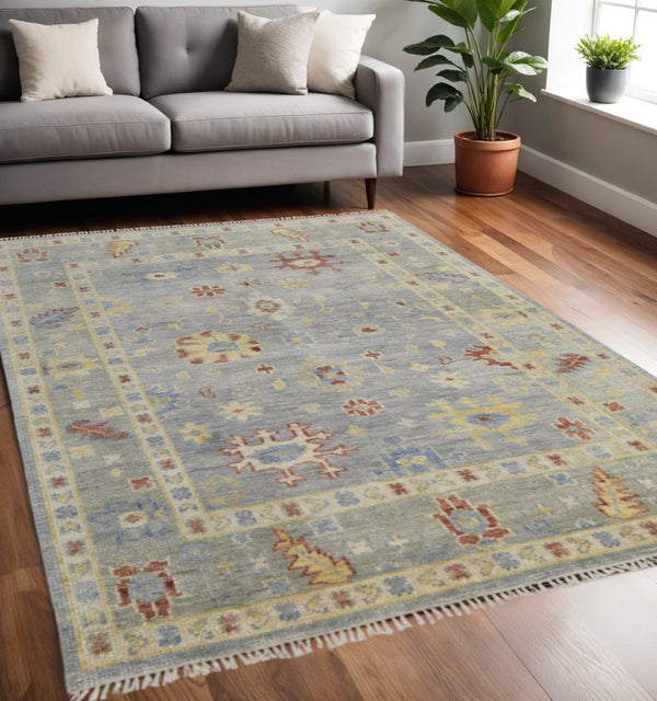 HomeRoots 3' Hand-Knotted Blue and Gray Floral Wool Area Rug with Fringe - Timeless Charm for Any Room 5' X 8' 567109