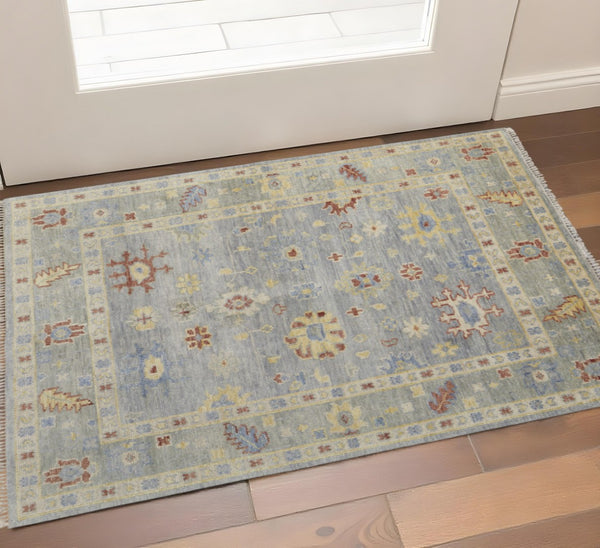 HomeRoots 3' Hand-Knotted Blue and Gray Floral Wool Area Rug with Fringe - Timeless Charm for Any Room 2' X 3' 567115