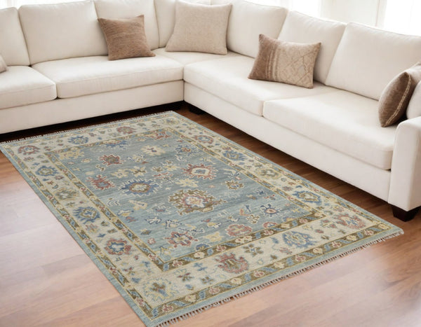 HomeRoots 4' Hand-Knotted Wool Area Rug in Blue, Ivory & Yellow Floral Design with Elegant Fringed Edges 5' X 8' 567132