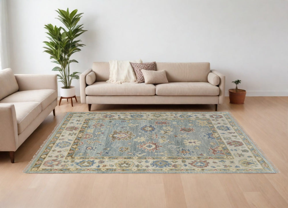 HomeRoots 4' Hand-Knotted Wool Area Rug in Blue, Ivory & Yellow Floral Design with Elegant Fringed Edges 8' X 10' 567133