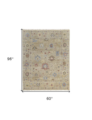 Homeroots 5' X 8' Tan Brown And Blue Wool Floral Hand Knotted Area Rug With Fringe Brown Wool 567138