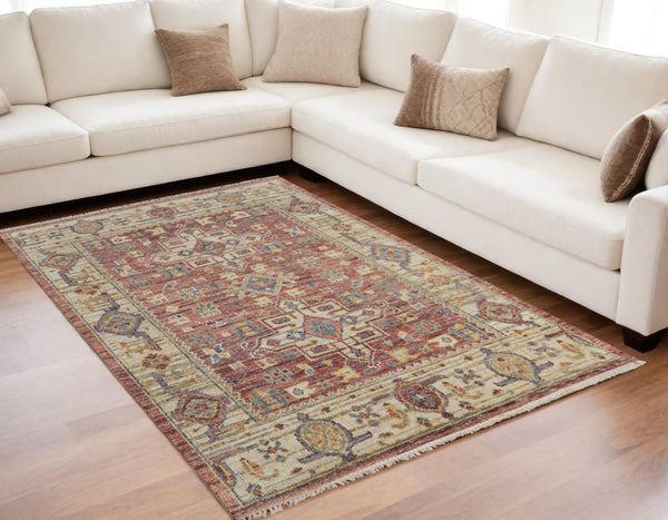 Homeroots 5' X 8' Ivory Red And Gold Wool Oriental Hand Knotted Area Rug With Fringe Red Wool 567146