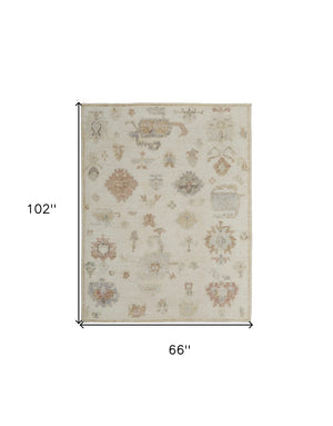 HomeRoots 6' Hand-Knotted Wool Floral Area Rug in Ivory, Tan, and Gray for Timeless Elegance and Durability 6' X 9' 567189