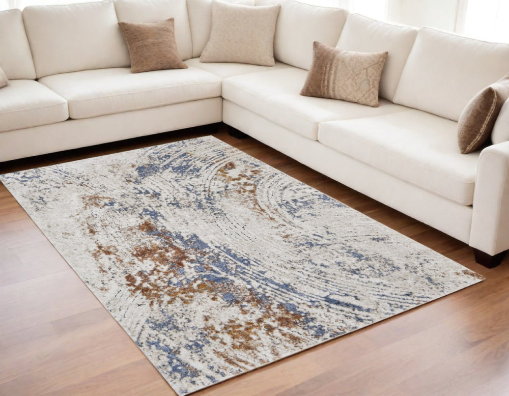 HomeRoots 5' Abstract Ivory Blue and Brown Area Rug – Modern Power Loom Design for Effortless Home Style 5' X 8' 567218