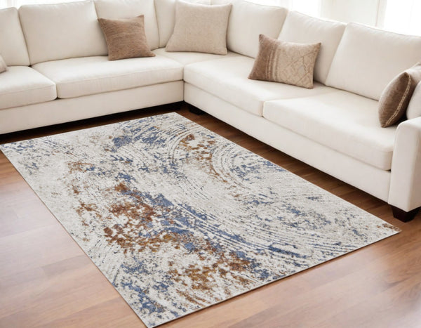 HomeRoots 5' Abstract Ivory Blue and Brown Area Rug – Modern Power Loom Design for Effortless Home Style 5' X 8' 567218