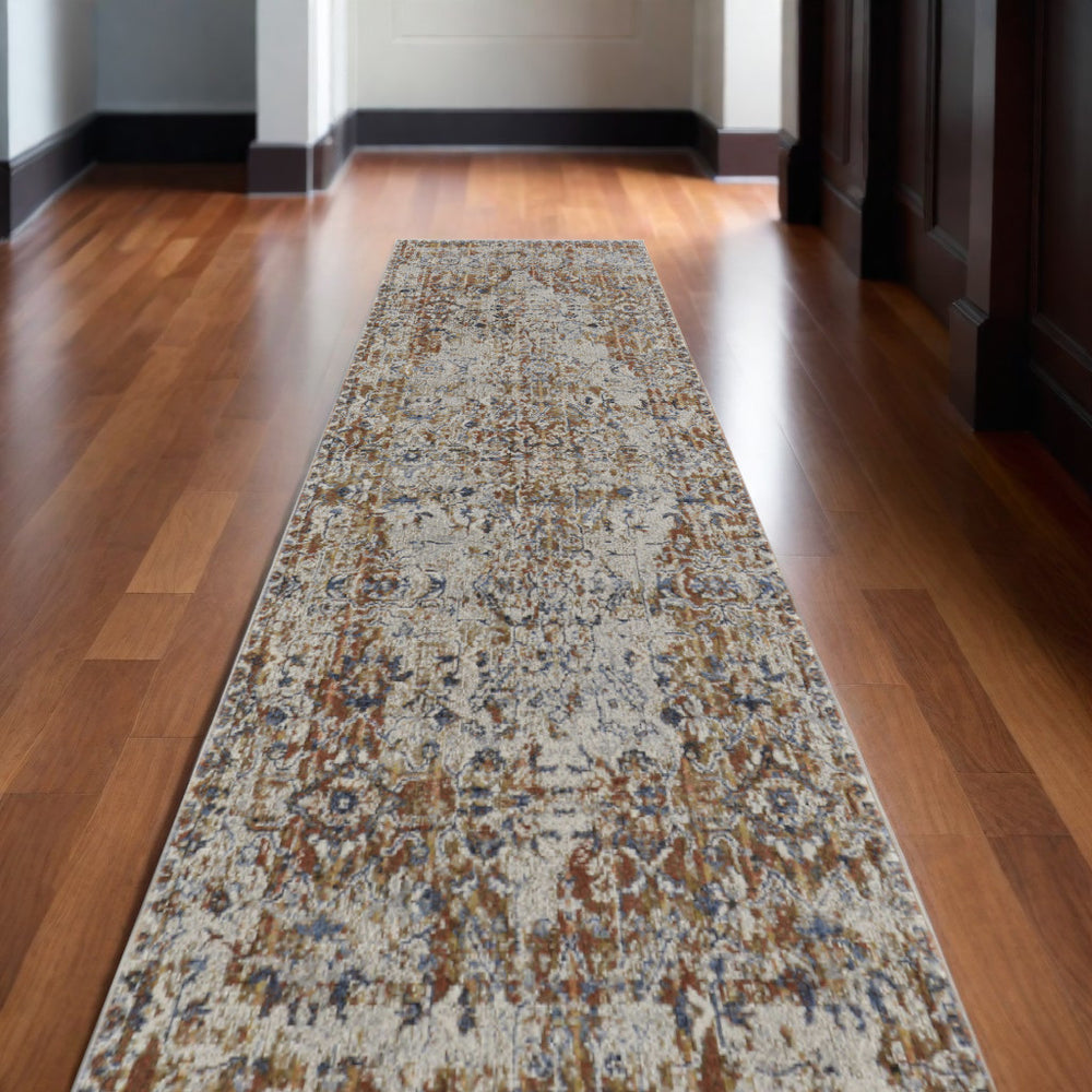 Homeroots 10' Tan Blue And Brown Oriental Power Loom Worn Faded Runner Rug With Fringe Gray Polypropylene 567275