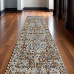 Homeroots 12' Tan Blue And Brown Oriental Power Loom Worn Faded Runner Rug With Fringe Gray Polypropylene 567276