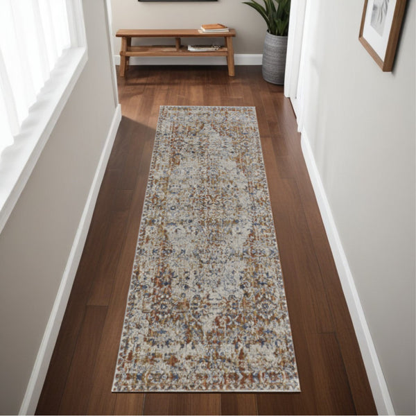Homeroots 8' Tan Blue And Brown Oriental Power Loom Worn Faded Runner Rug With Fringe Gray Polypropylene 567277