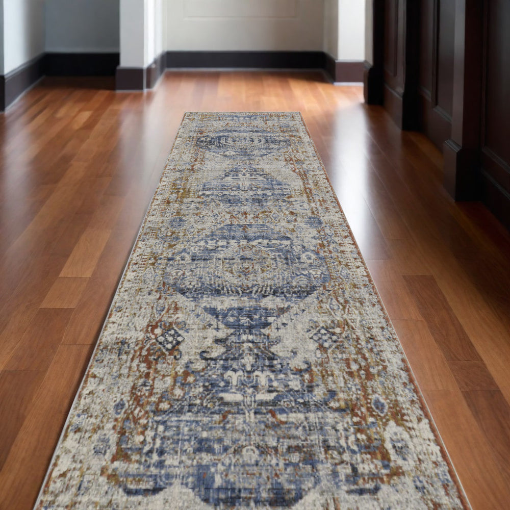 Homeroots 10' Gray Blue And Orange Oriental Power Loom Worn Faded Runner Rug With Fringe Ivory Polypropylene 567279