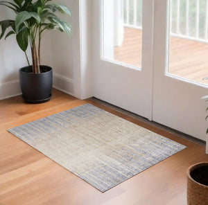 Homeroots 3' X 5' Ivory Tan And Blue Ombre Power Loom Worn Faded Area Rug Gray Polyester 567315